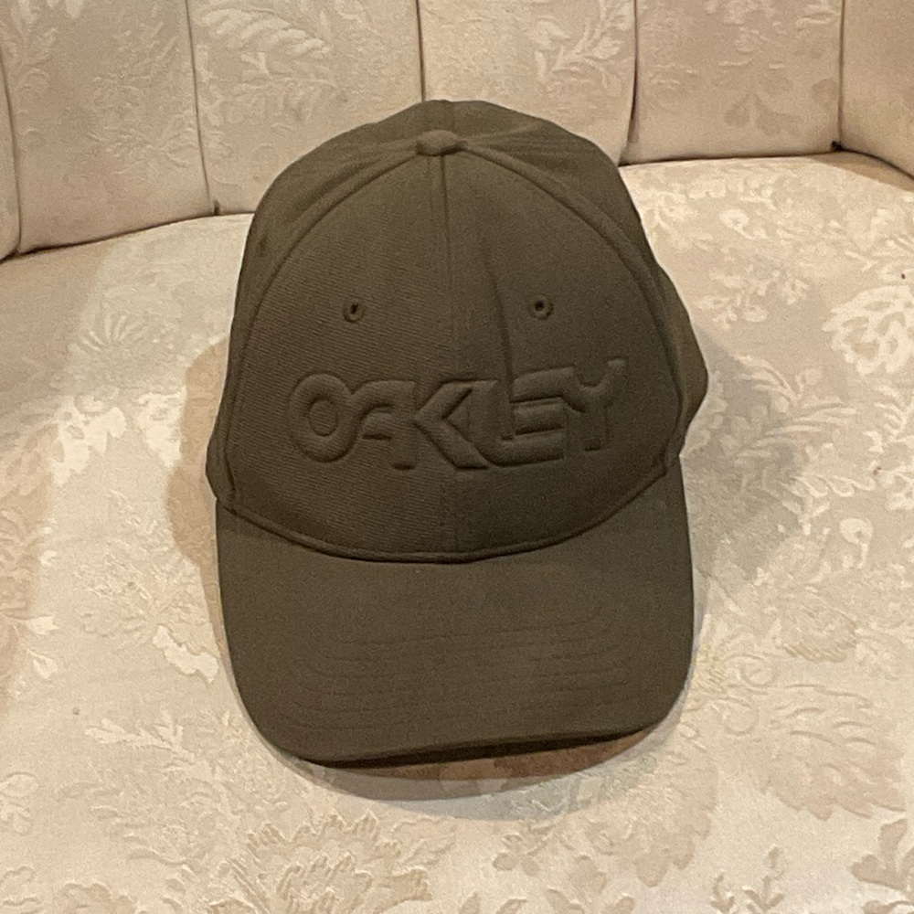 Oakley stretch cap. Dark sage. L-XL. Slight discolor on top button.